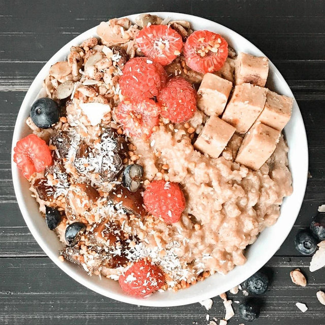 Chai-spiced millet porridge with fruit and a G2G bar topping